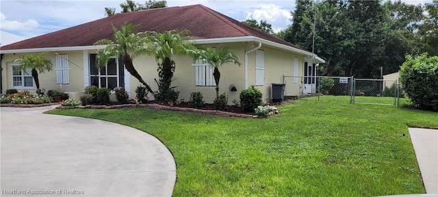 view of side of home with a lawn