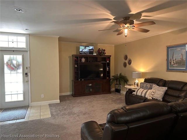 tiled living room featuring ceiling fan and ornamental molding