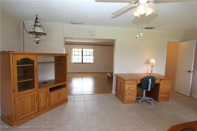 unfurnished office featuring crown molding, light tile patterned floors, and a textured ceiling