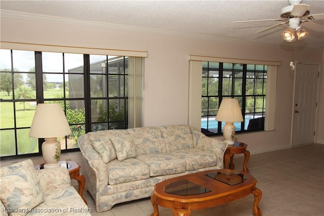 tiled living room with ceiling fan, crown molding, and a textured ceiling