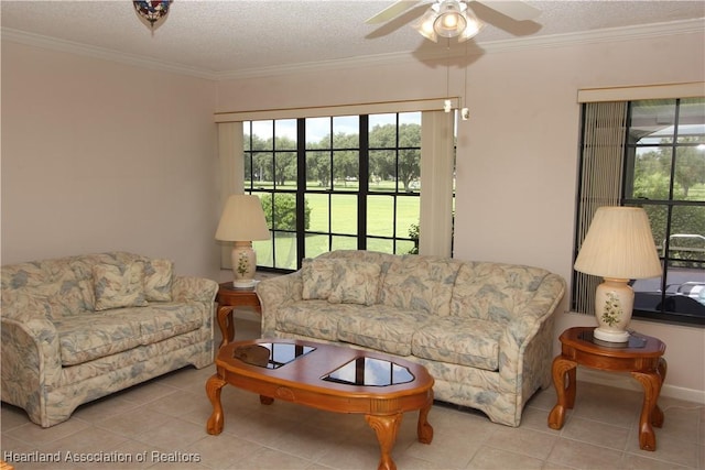 tiled living room featuring a textured ceiling, ceiling fan, and crown molding