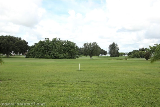 surrounding community featuring a lawn