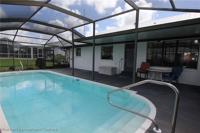 view of pool featuring a lanai and a patio