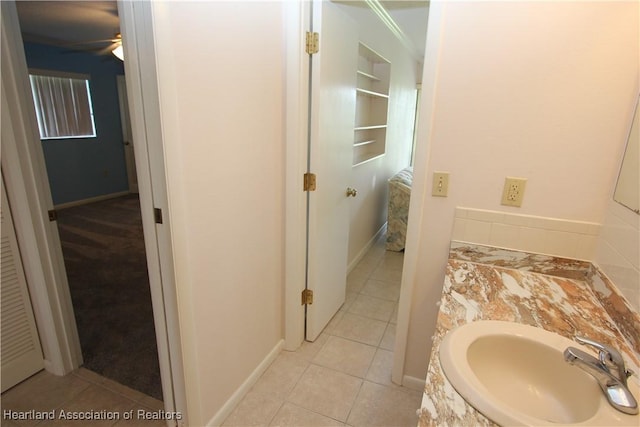 bathroom featuring tile patterned flooring and vanity