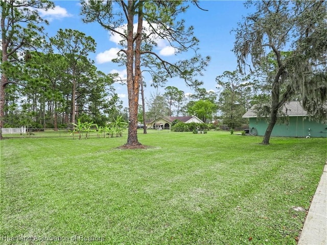 view of yard with fence