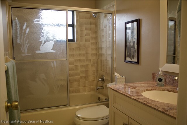102 Oak St, Lake Placid, FL 33852 - bathroom featuring shower / bath combination with glass door, vanity, and toilet
