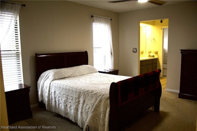 102 Oak St, Lake Placid, FL 33852 - bedroom featuring carpet, connected bathroom, and baseboards