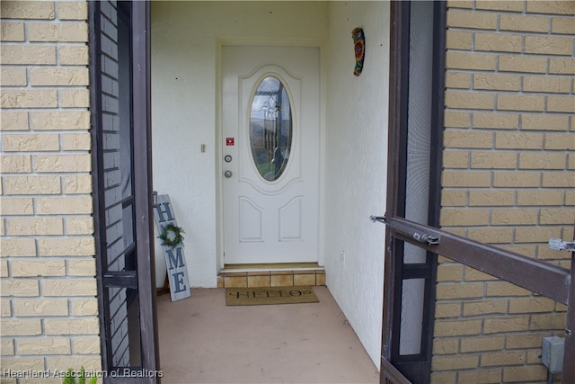 102 Oak St, Lake Placid, FL 33852 - view of exterior entry featuring brick siding