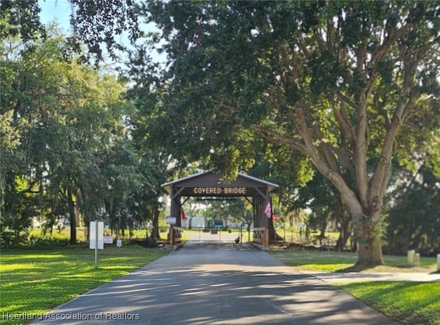 102 Oak St, Lake Placid, FL 33852 - view of home's community featuring driveway, a yard, a detached carport, and a gazebo