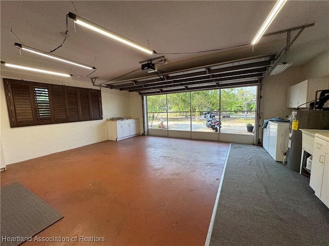 246 Thurman Ave, Lake Placid, FL 33852 - garage featuring washing machine and dryer, a garage door opener, and electric water heater