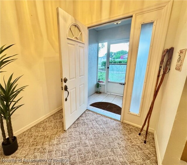 246 Thurman Ave, Lake Placid, FL 33852 - entryway featuring light colored carpet and baseboards