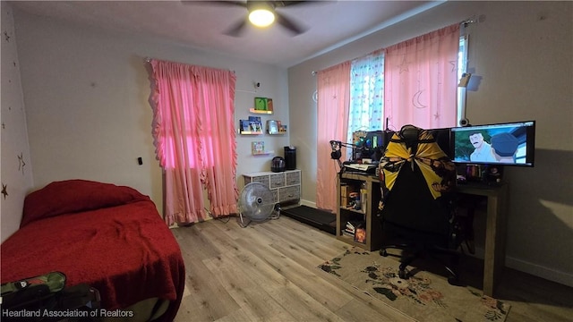 301 Sparrow Ave, Sebring, FL 33870 - bedroom featuring light wood-type flooring and ceiling fan