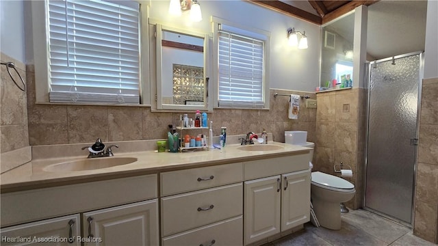 301 Sparrow Ave, Sebring, FL 33870 - full bathroom featuring double vanity, tile walls, a shower stall, and tile patterned flooring