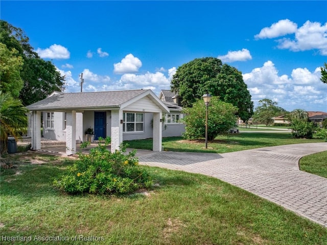301 Sparrow Ave, Sebring, FL 33870 - view of front of property featuring a front yard and brick siding