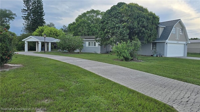 301 Sparrow Ave, Sebring, FL 33870 - view of front of home featuring a front yard, a garage, stucco siding, driveway, and a shingled roof