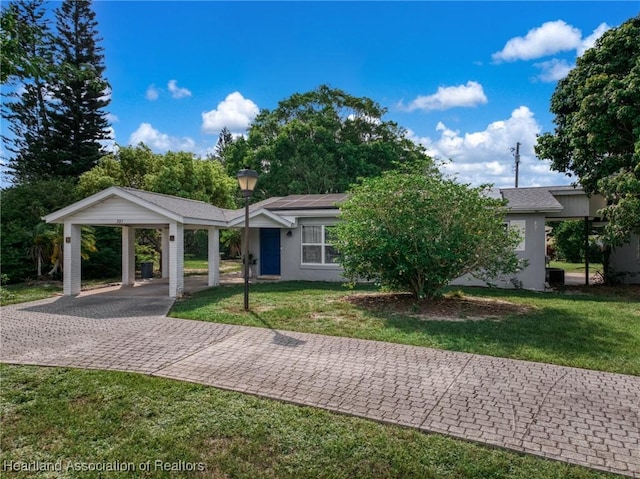 301 Sparrow Ave, Sebring, FL 33870 - view of front of house with decorative driveway and a front lawn