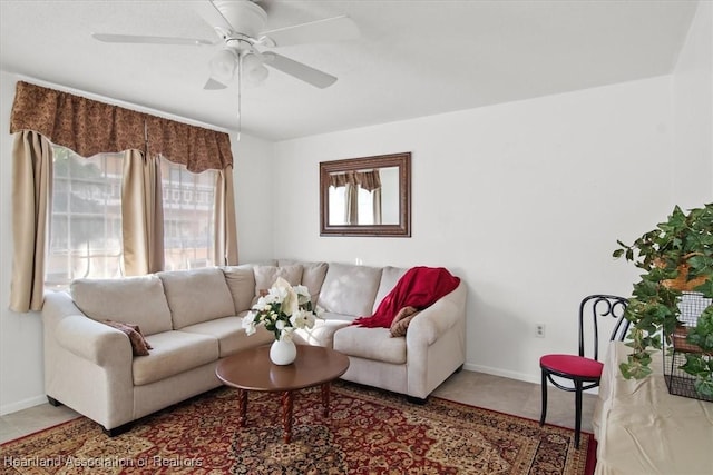 living room with tile patterned floors and ceiling fan