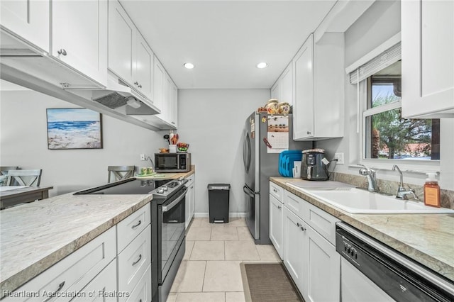 kitchen featuring sink, light tile patterned floors, stainless steel appliances, light stone countertops, and white cabinets