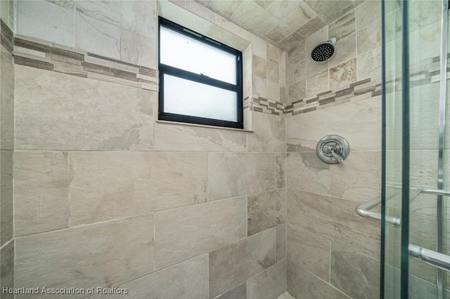 bathroom with a tile shower