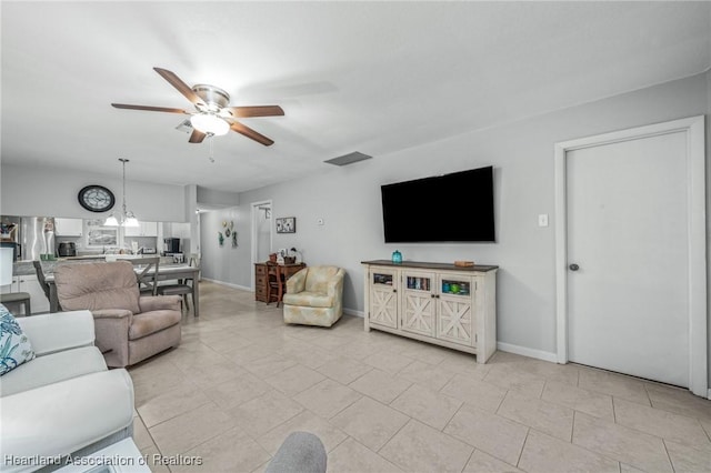 living room featuring ceiling fan