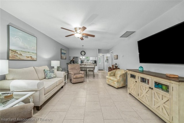 living room with light tile patterned flooring and ceiling fan