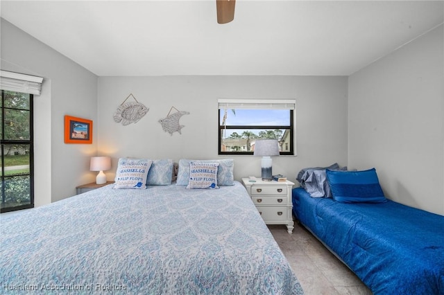 bedroom with light tile patterned floors and ceiling fan