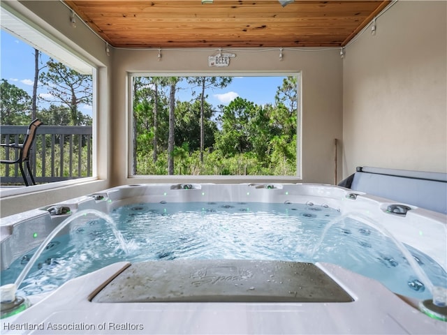 view of pool featuring a hot tub