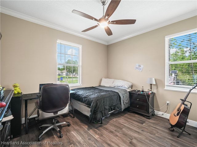 bedroom featuring dark wood-type flooring, ceiling fan, and ornamental molding