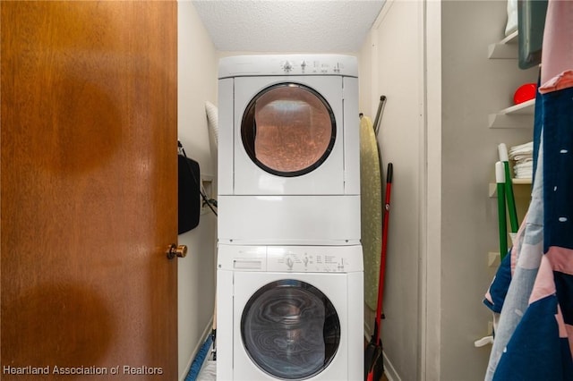 19 A Miracle Ave, Avon Park, FL 33825 - laundry area with stacked washer and clothes dryer and a textured ceiling