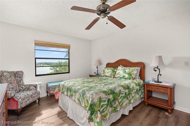 19 A Miracle Ave, Avon Park, FL 33825 - bedroom with wood finished floors, a textured ceiling, and a ceiling fan