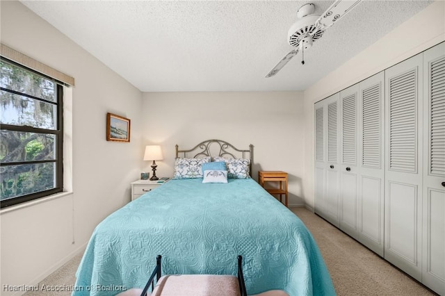 19 A Miracle Ave, Avon Park, FL 33825 - bedroom featuring light carpet, a closet, a ceiling fan, and a textured ceiling