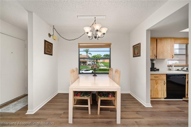 19 A Miracle Ave, Avon Park, FL 33825 - dining area featuring a chandelier, wood finished floors, and a textured ceiling
