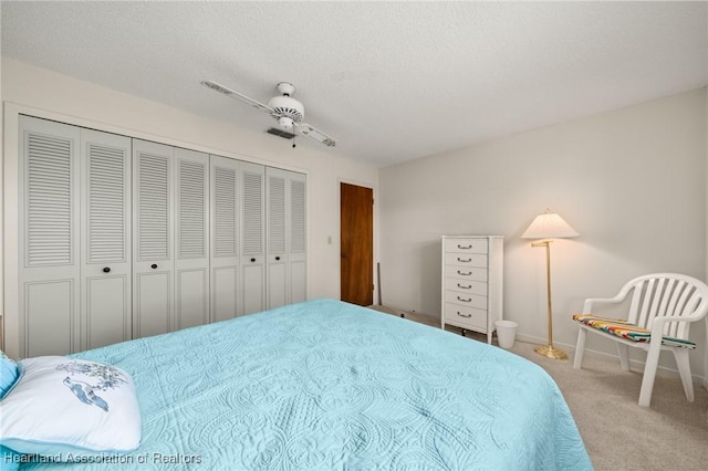 19 A Miracle Ave, Avon Park, FL 33825 - carpeted bedroom featuring ceiling fan, a closet, and a textured ceiling
