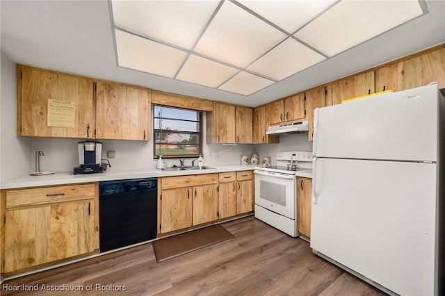 19 A Miracle Ave, Avon Park, FL 33825 - kitchen with white appliances, under cabinet range hood, light countertops, and dark wood-style floors