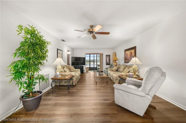 19 A Miracle Ave, Avon Park, FL 33825 - living room featuring ceiling fan and wood finished floors
