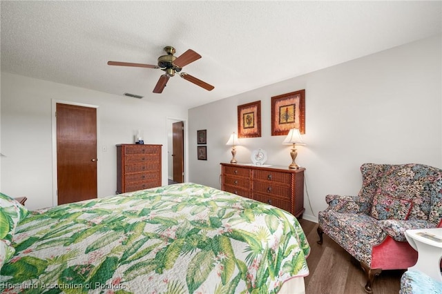 19 A Miracle Ave, Avon Park, FL 33825 - bedroom with wood finished floors and a ceiling fan