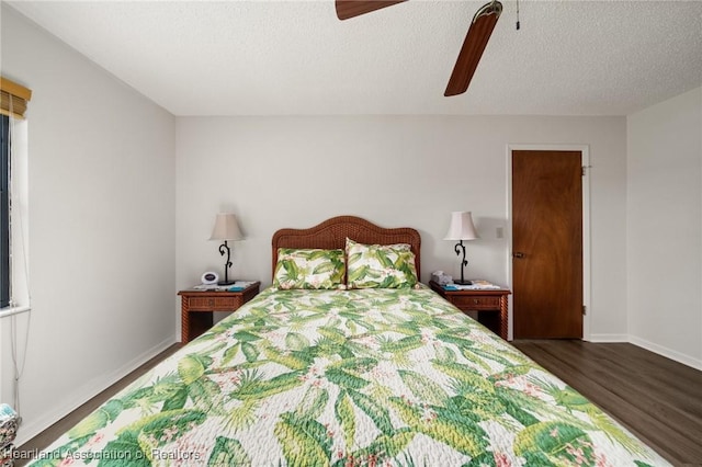 19 A Miracle Ave, Avon Park, FL 33825 - bedroom featuring dark wood-type flooring, ceiling fan, and a textured ceiling