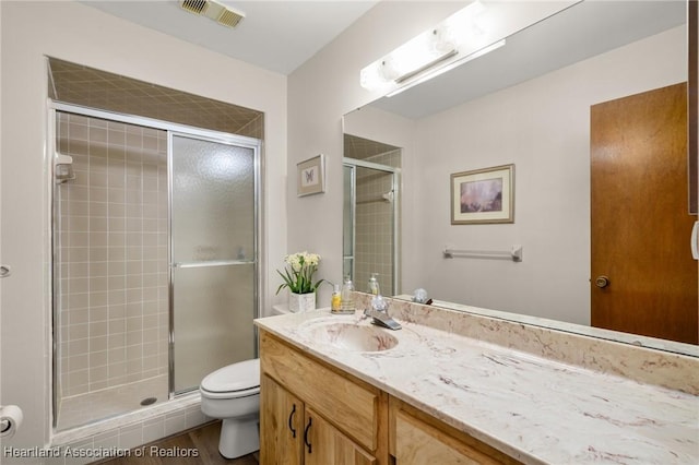 19 A Miracle Ave, Avon Park, FL 33825 - full bath featuring vanity, a shower stall, and wood finished floors