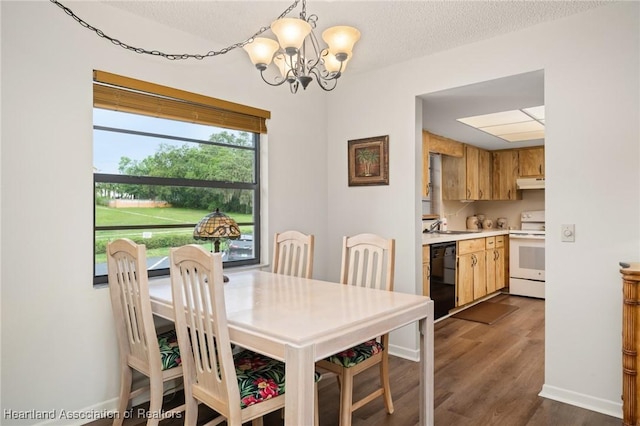 19 A Miracle Ave, Avon Park, FL 33825 - dining room with a chandelier, dark wood-style floors, and a textured ceiling