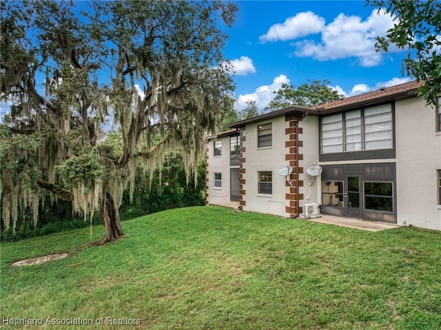 19 A Miracle Ave, Avon Park, FL 33825 - rear view of property with stucco siding