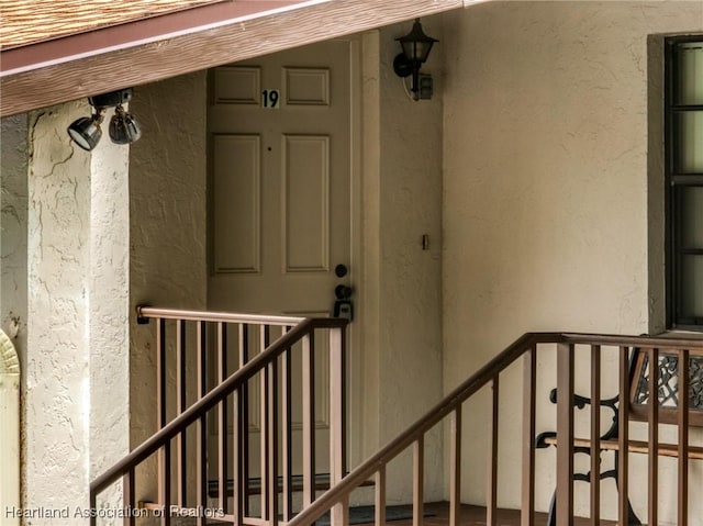 19 A Miracle Ave, Avon Park, FL 33825 - staircase with a textured wall