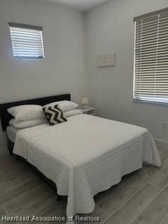 bedroom featuring wood finished floors