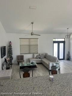 living room featuring a ceiling fan