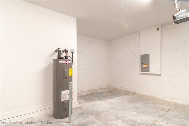 interior space featuring a garage door opener, electric panel, and water heater