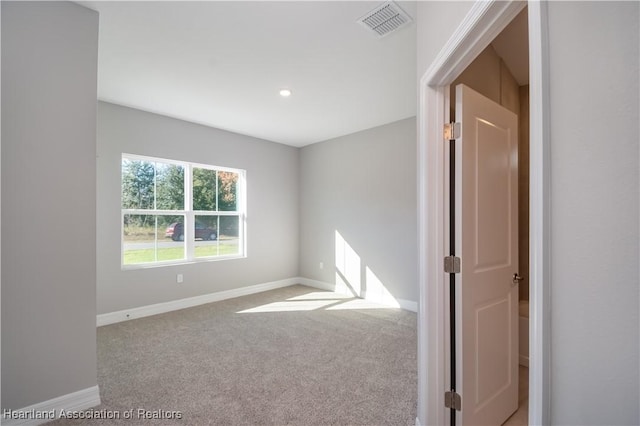 empty room featuring carpet flooring