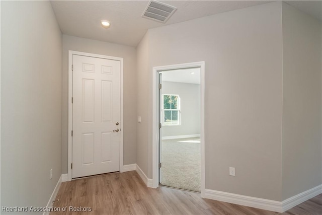 corridor featuring light hardwood / wood-style flooring