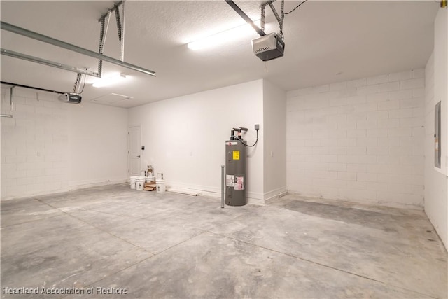 garage with a garage door opener and water heater