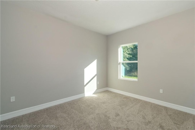 empty room with light colored carpet