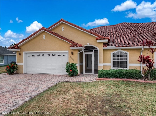 6918 San Benito Dr, Sebring, FL 33872 - mediterranean / spanish house with an attached garage, stucco siding, decorative driveway, and a tile roof