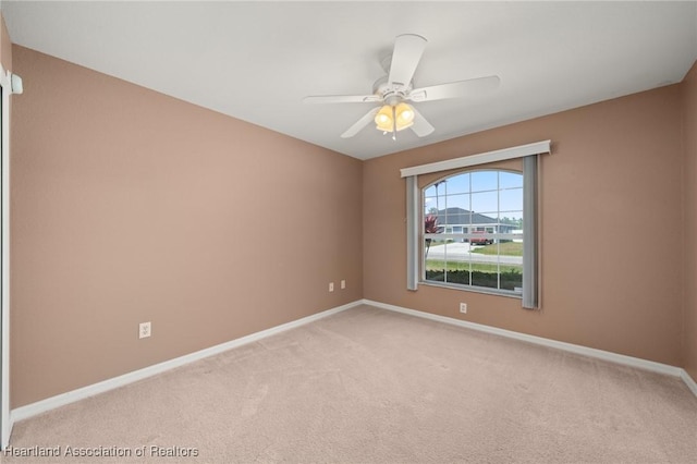 6918 San Benito Dr, Sebring, FL 33872 - unfurnished room featuring light carpet, baseboards, and ceiling fan